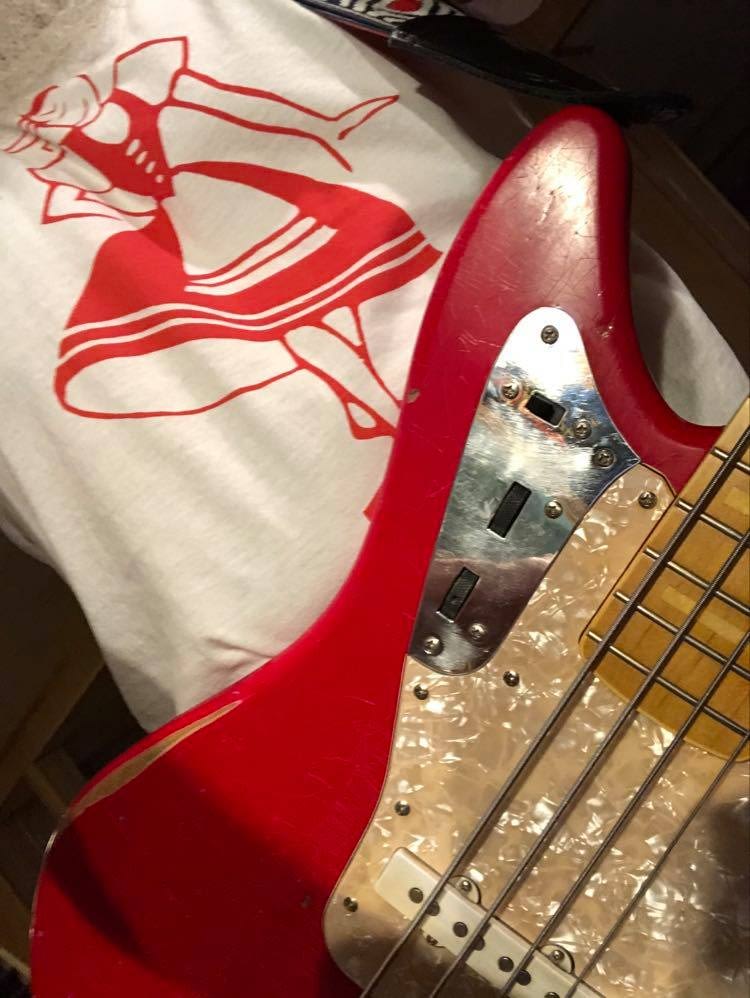 Red Polish Dancer shirt from Mrugacz and a red bass guitar.