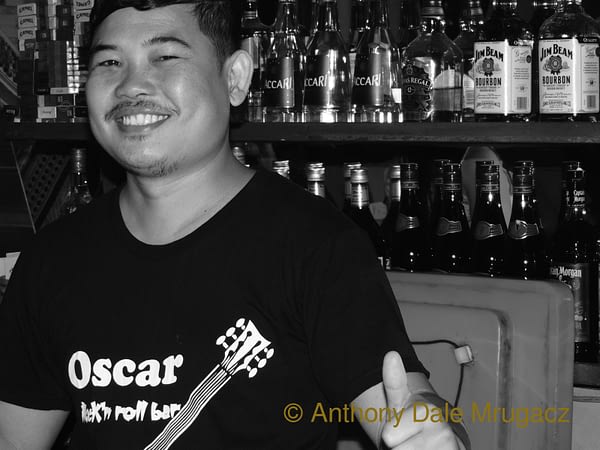Mr Vy bartending at Oscar's in Phnom Penh, Cambodia.