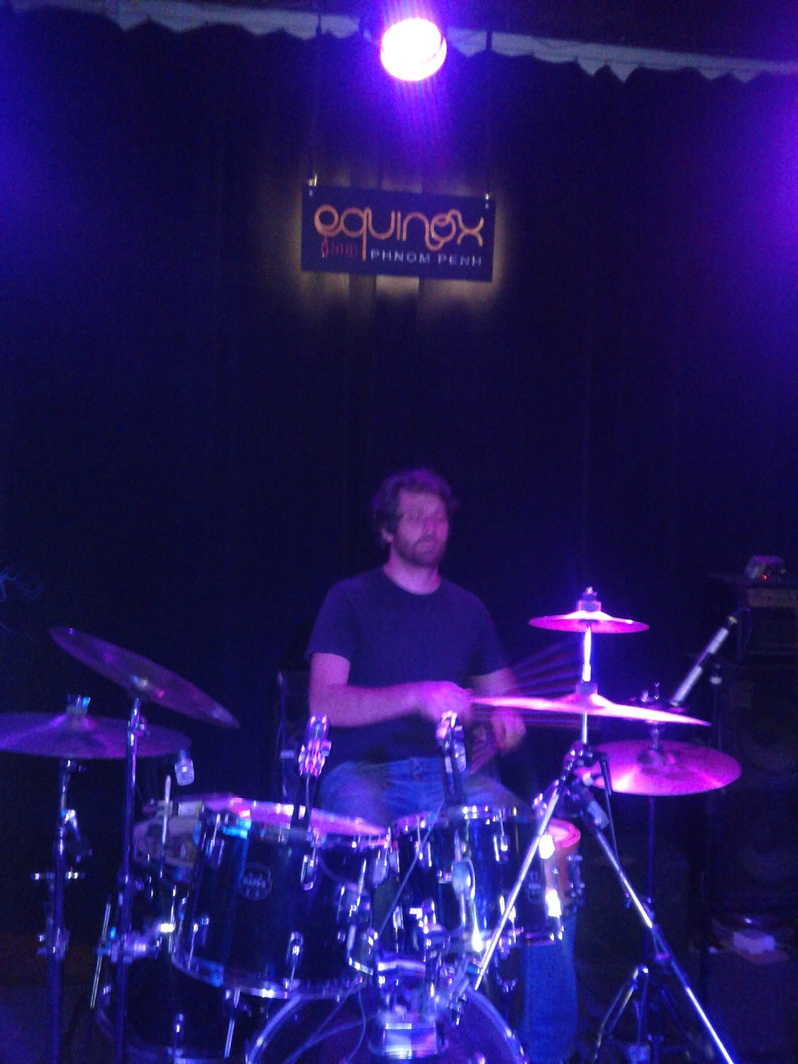 Greg Lavender playing drums at Equinox.